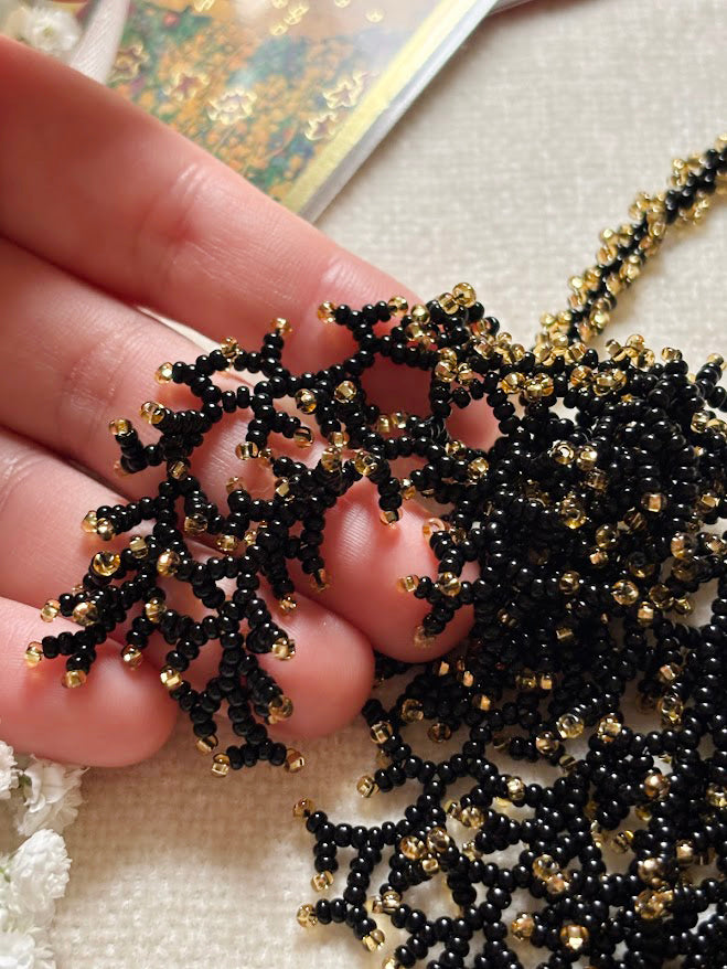 Black and Gold Beaded Collar Necklace with Coral Branch Design