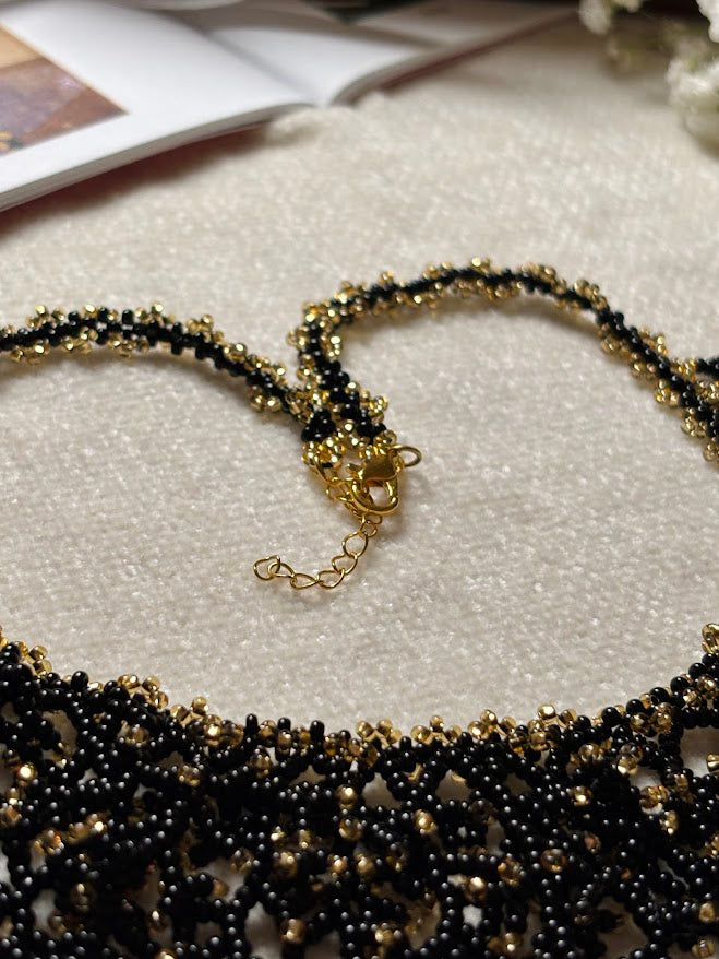 Black and Gold Beaded Collar Necklace with Coral Branch Design