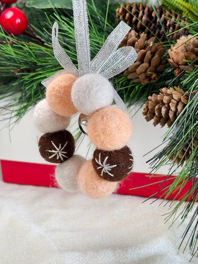 Handmade Wool Christmas Ornament with Neutral Tones and Silver Ribbon